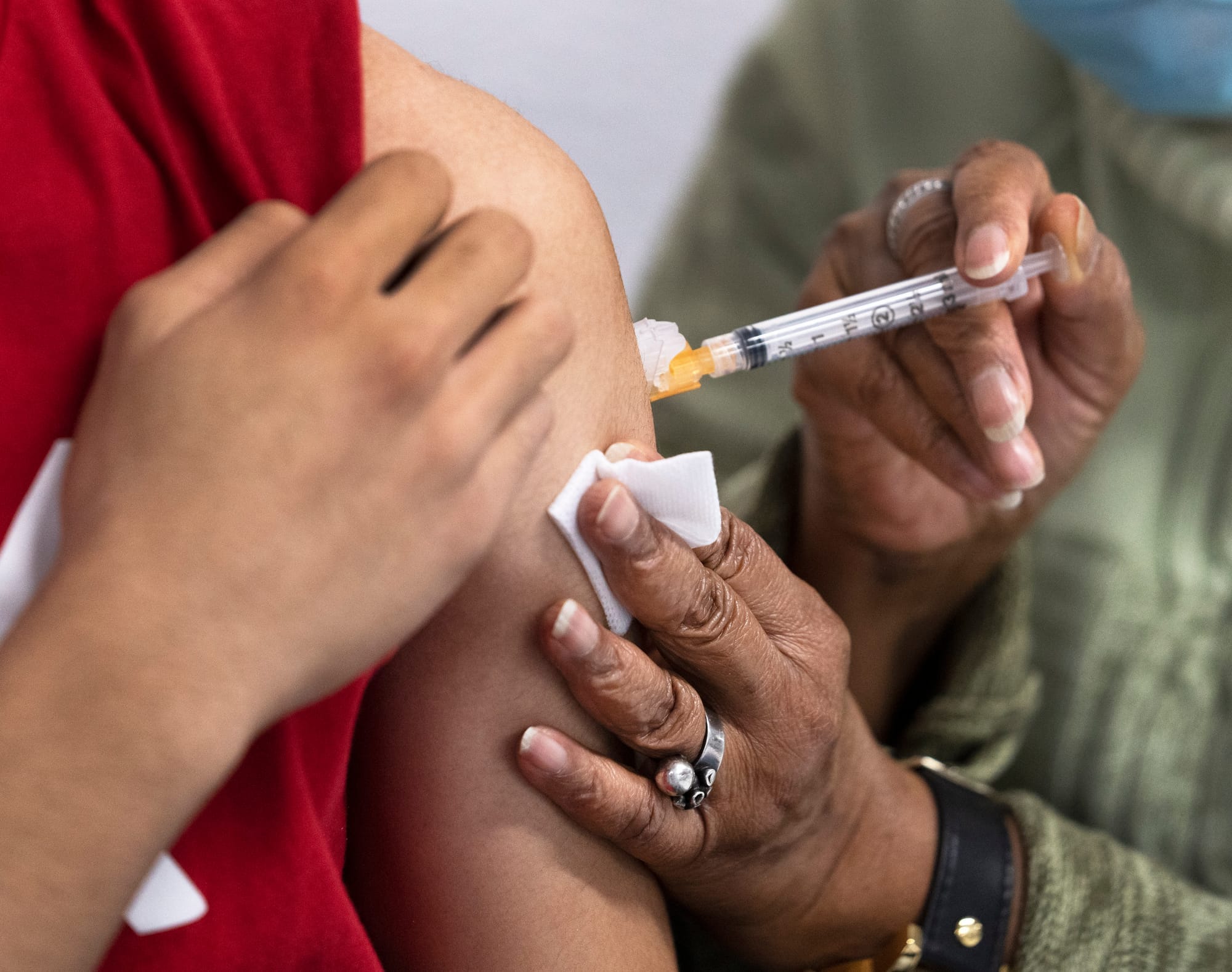 A person receives a COVID-19 vaccine at a Montreal clinic in 2021.