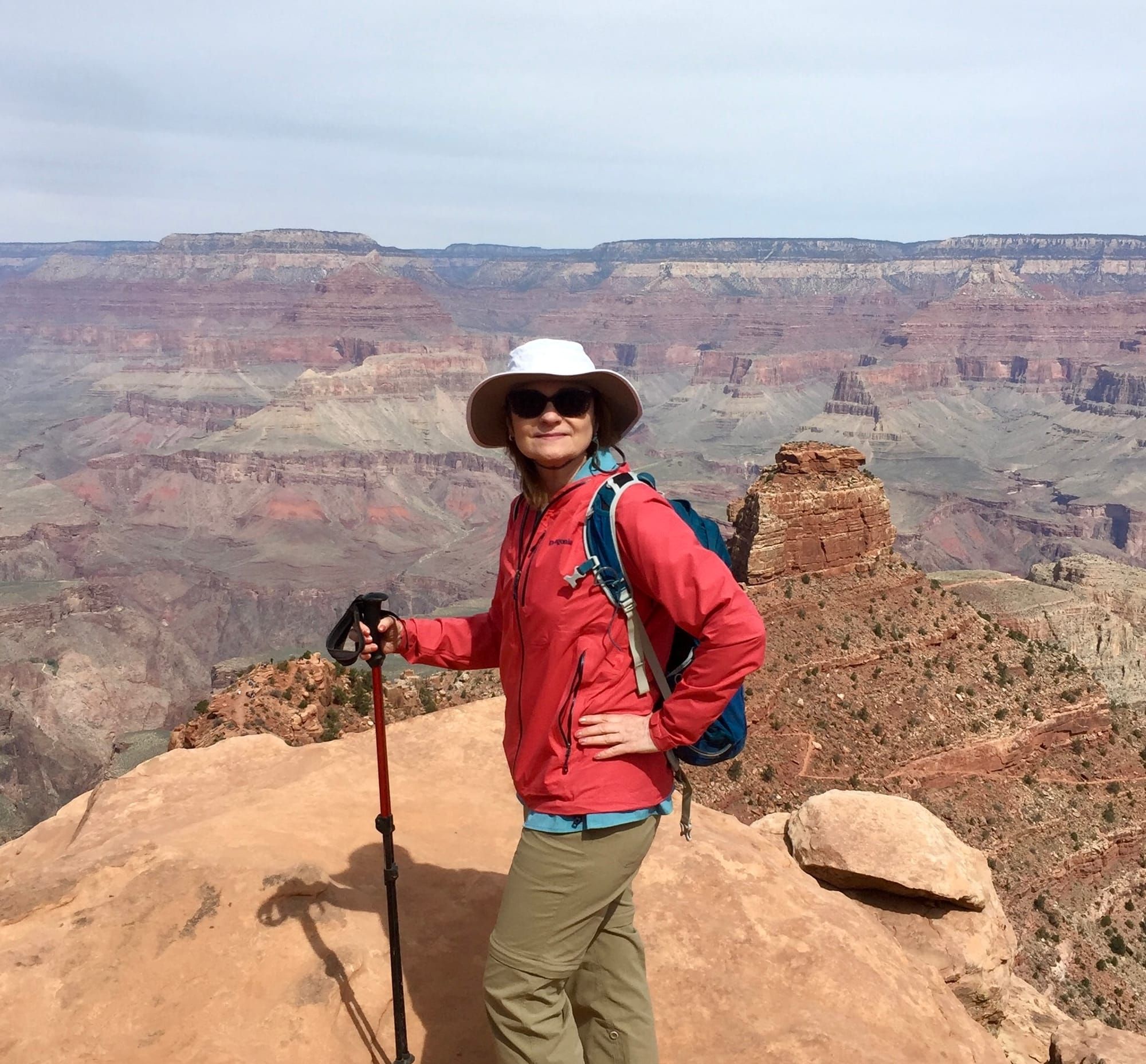 Anne Neufeld standing in front of the Grand Canyon.