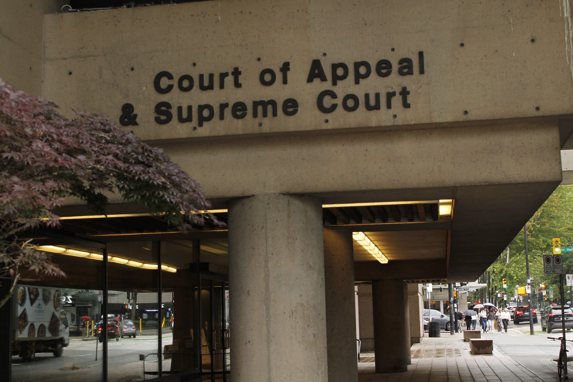 A large concrete entranceway with a sign that reads "Court of Appeal & Supreme Court." 