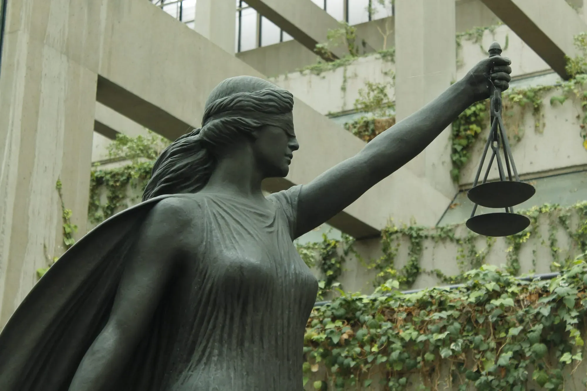 A large statue of a blindfolded woman holding scales is pictured in the Vancouver B.C. Supreme Court. 